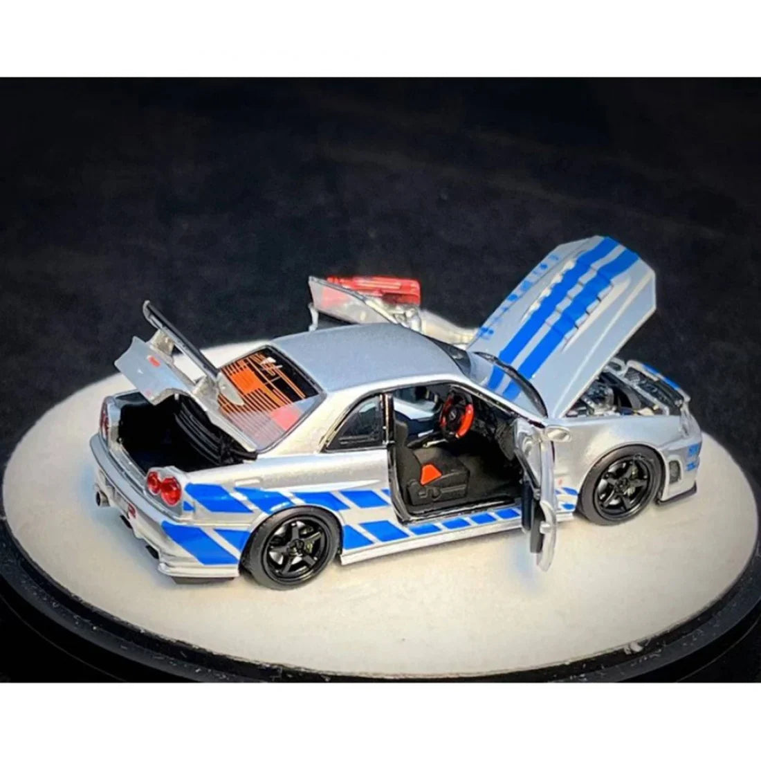 PGM 1/64 PGM Nissan Skyline GT-R R34 FNF Silver-Blue
