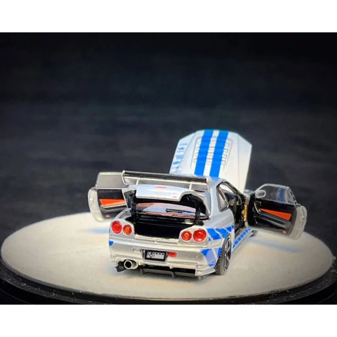 PGM 1/64 PGM Nissan Skyline GT-R R34 FNF Silver-Blue
