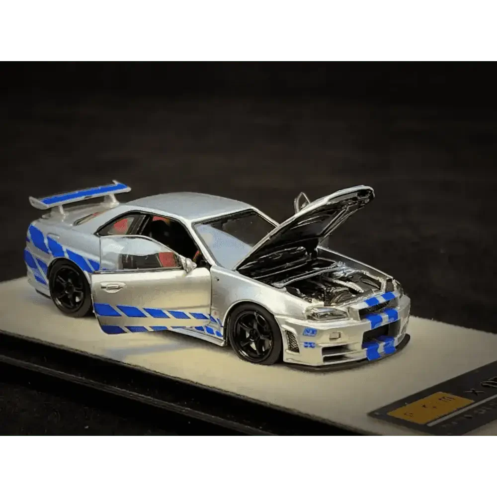 PGM 1/64 PGM Nissan Skyline GT-R R34 FNF Silver-Blue