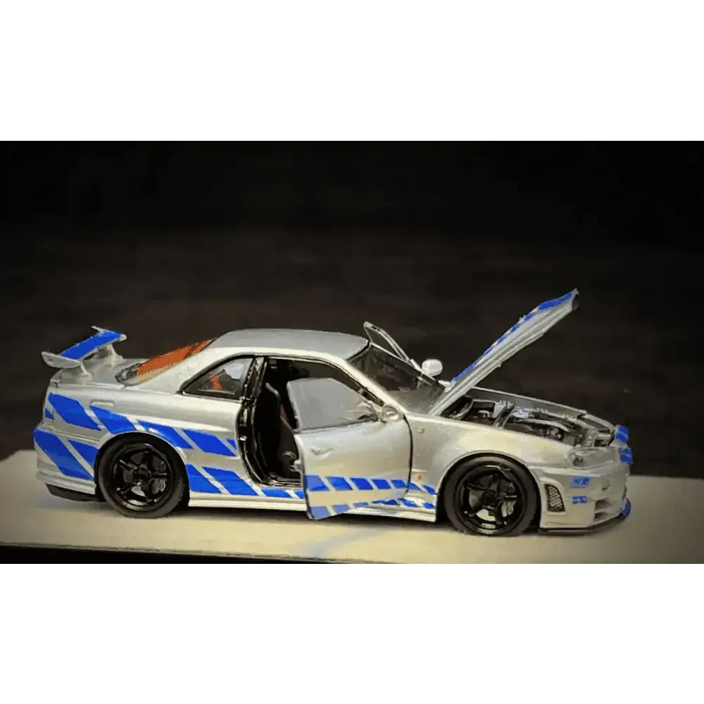 PGM 1/64 PGM Nissan Skyline GT-R R34 FNF Silver-Blue