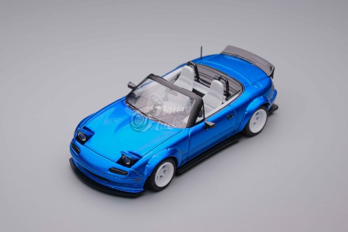 Microturbo 1/64 Pandem Rocket Bunny MX-5 Eunos Roadster (NA/Miata)
Metallic Blue Color, Retractable-Headlight